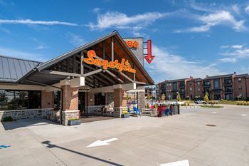 Across from sugarfire restaurant with sand volleyball